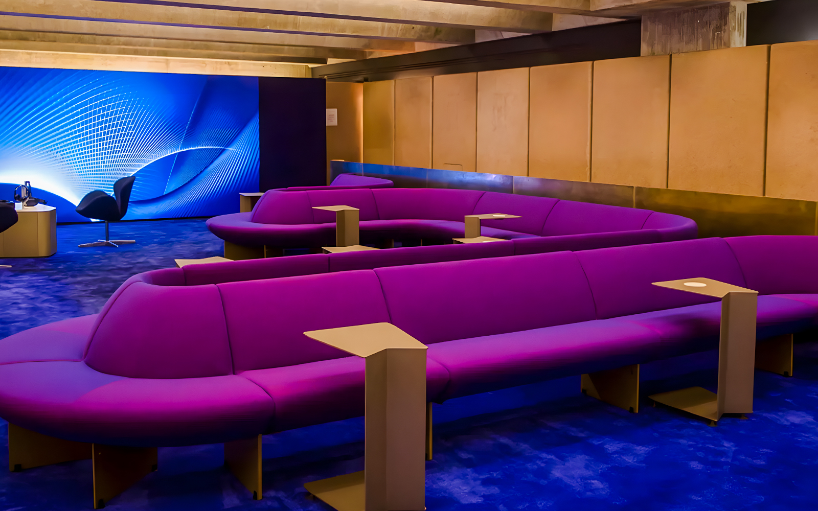 Purple seating area in The Lounge at Sydney Opera House with modern decor.