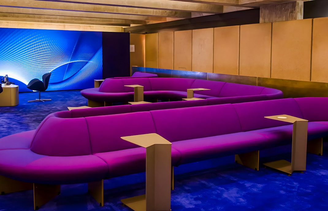 Purple seating area in The Lounge at Sydney Opera House with modern decor.