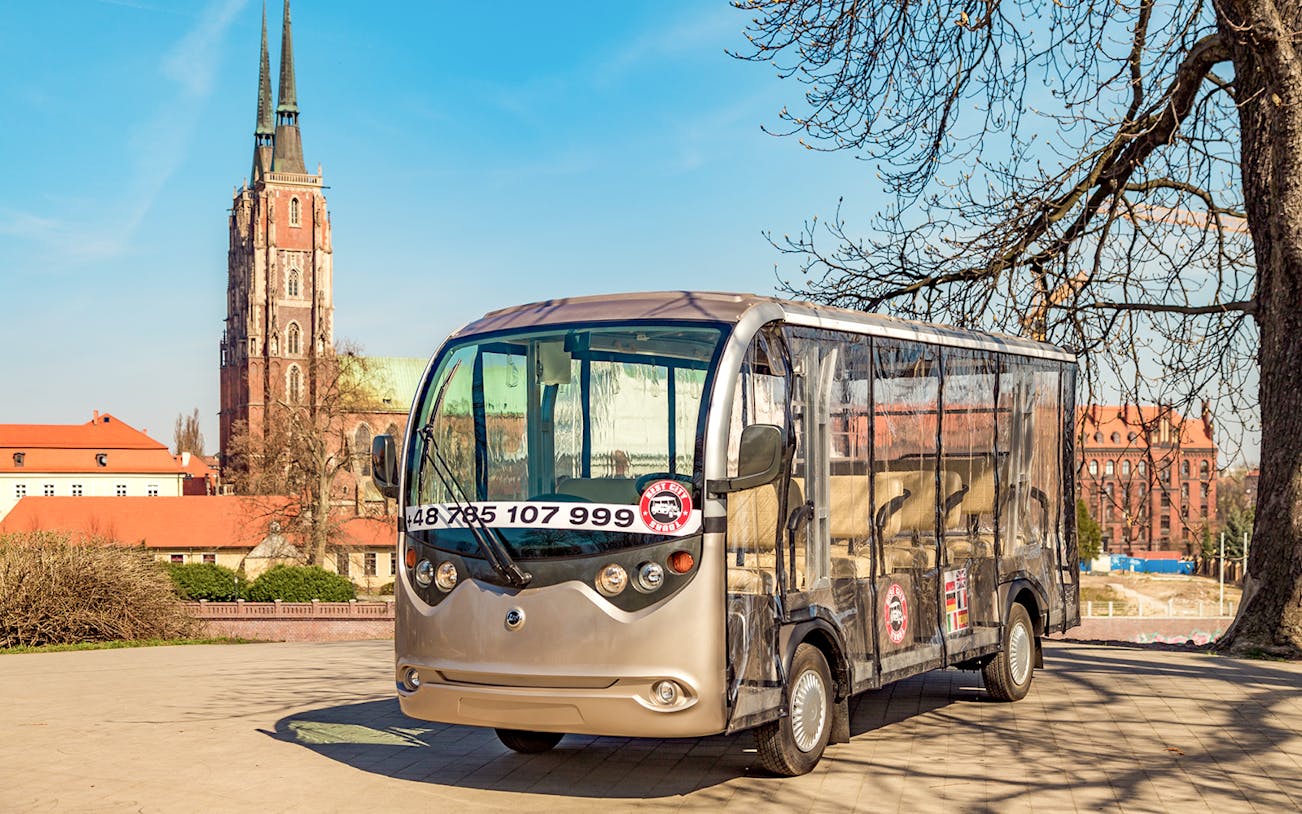 Electric car for Wroclaw 2-hour private guided tour with cathedral in background.