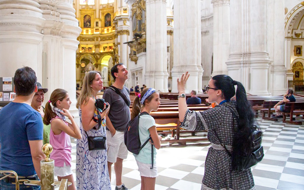 Guided tour group inside Granada Cathedral.