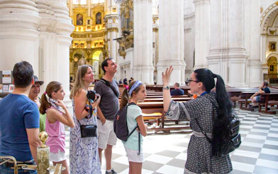 Guided tour group inside Granada Cathedral.