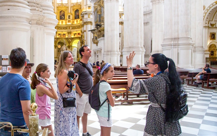 Guided tour group inside Granada Cathedral.