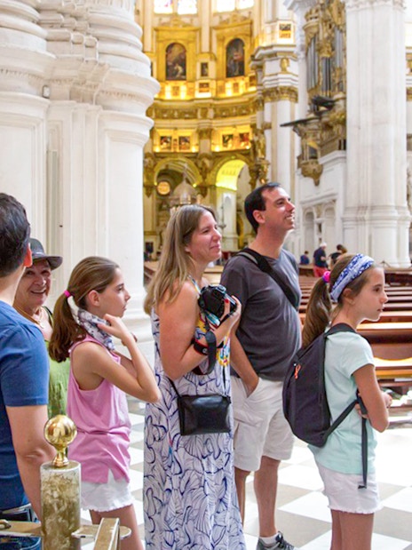 Guided tour group inside Granada Cathedral.