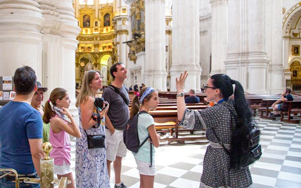 Guided tour group inside Granada Cathedral.