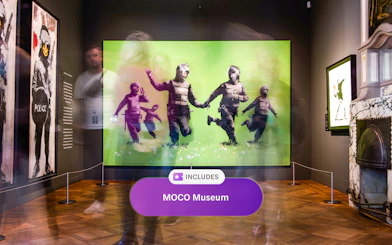 MOCO Museum Amsterdam art exhibit with vibrant green artwork and visitors.