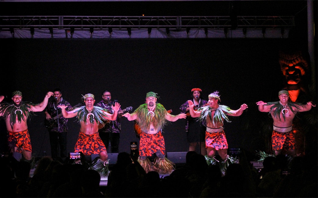 Performers in traditional attire dancing at Moana Luau, Hawaii.