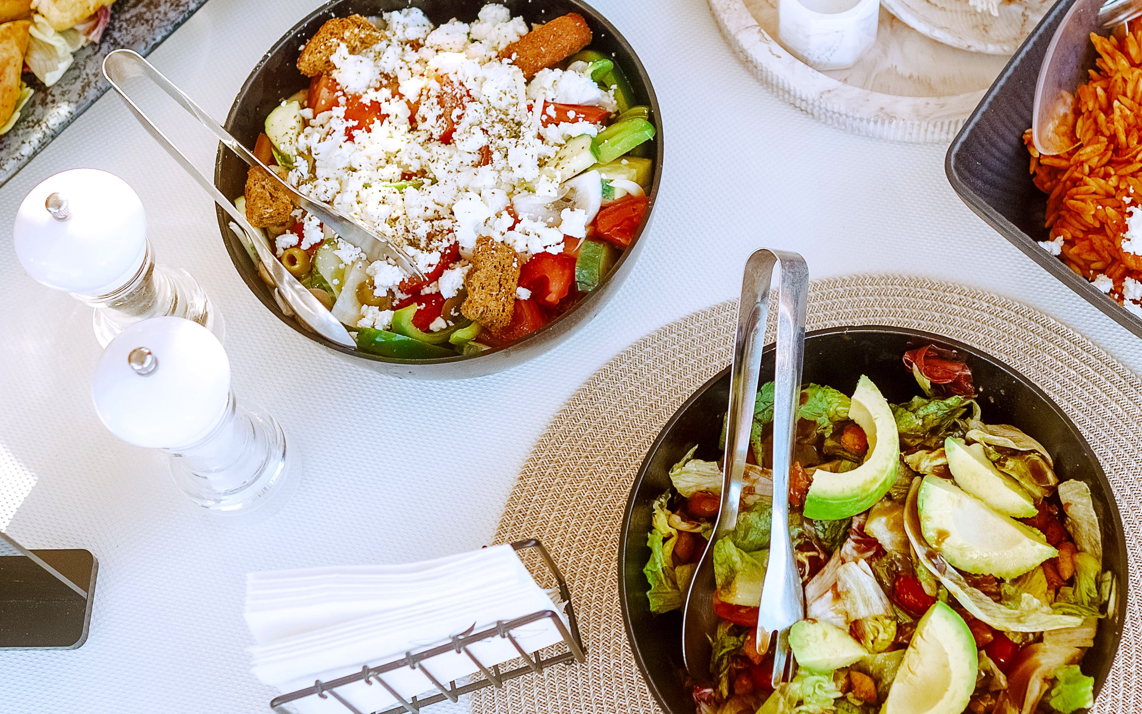 Lunch spread on luxury catamaran cruise to Chrissi Island with salads and appetizers.