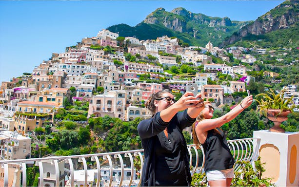 Pompeii ruins with Mount Vesuvius, scenic Amalfi Coast drive, and Positano view on guided day tour from Rome.
