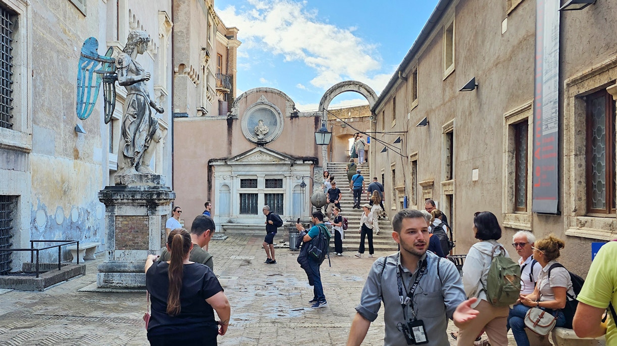 Visitors exploring the courtyard of Castel Sant'Angelo, Rome.