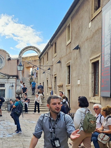 Visitors exploring the courtyard of Castel Sant'Angelo, Rome.