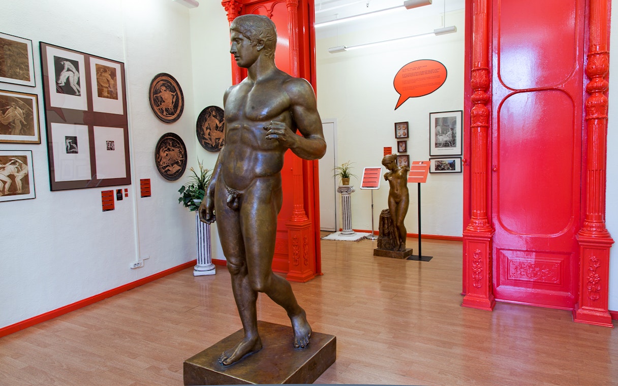 Statues and artwork inside the Erotic Museum Barcelona exhibit room.