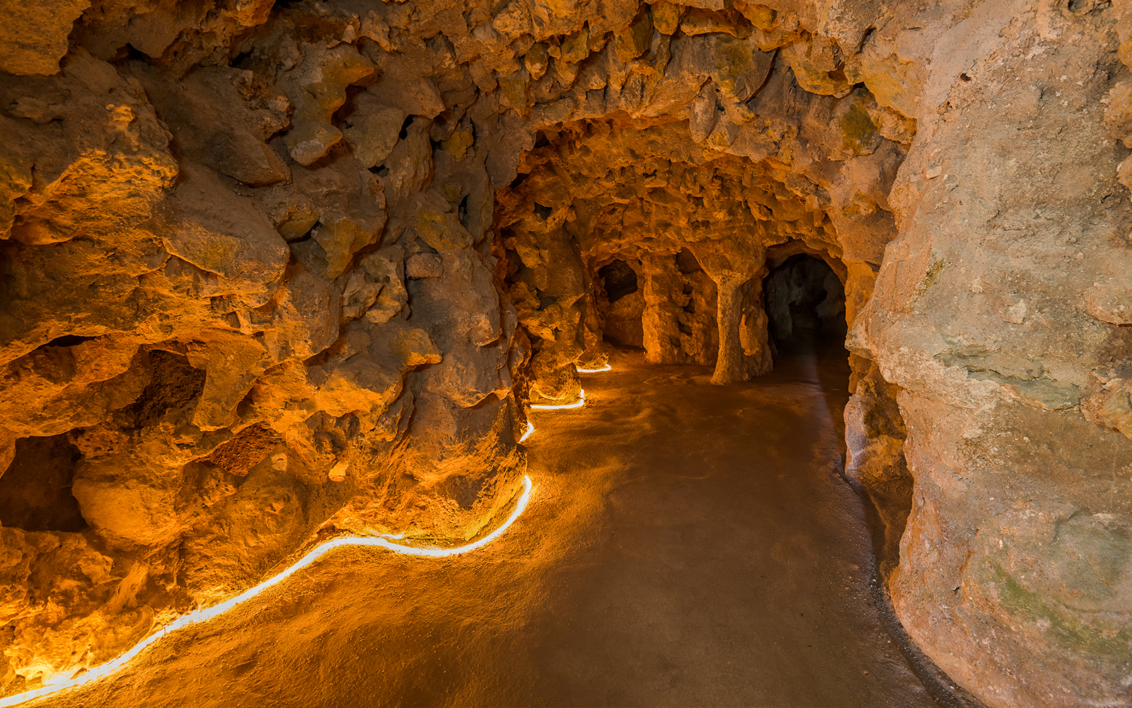 Underground tunnel with stone walls at Quinta da Regaleira, Lisbon.
