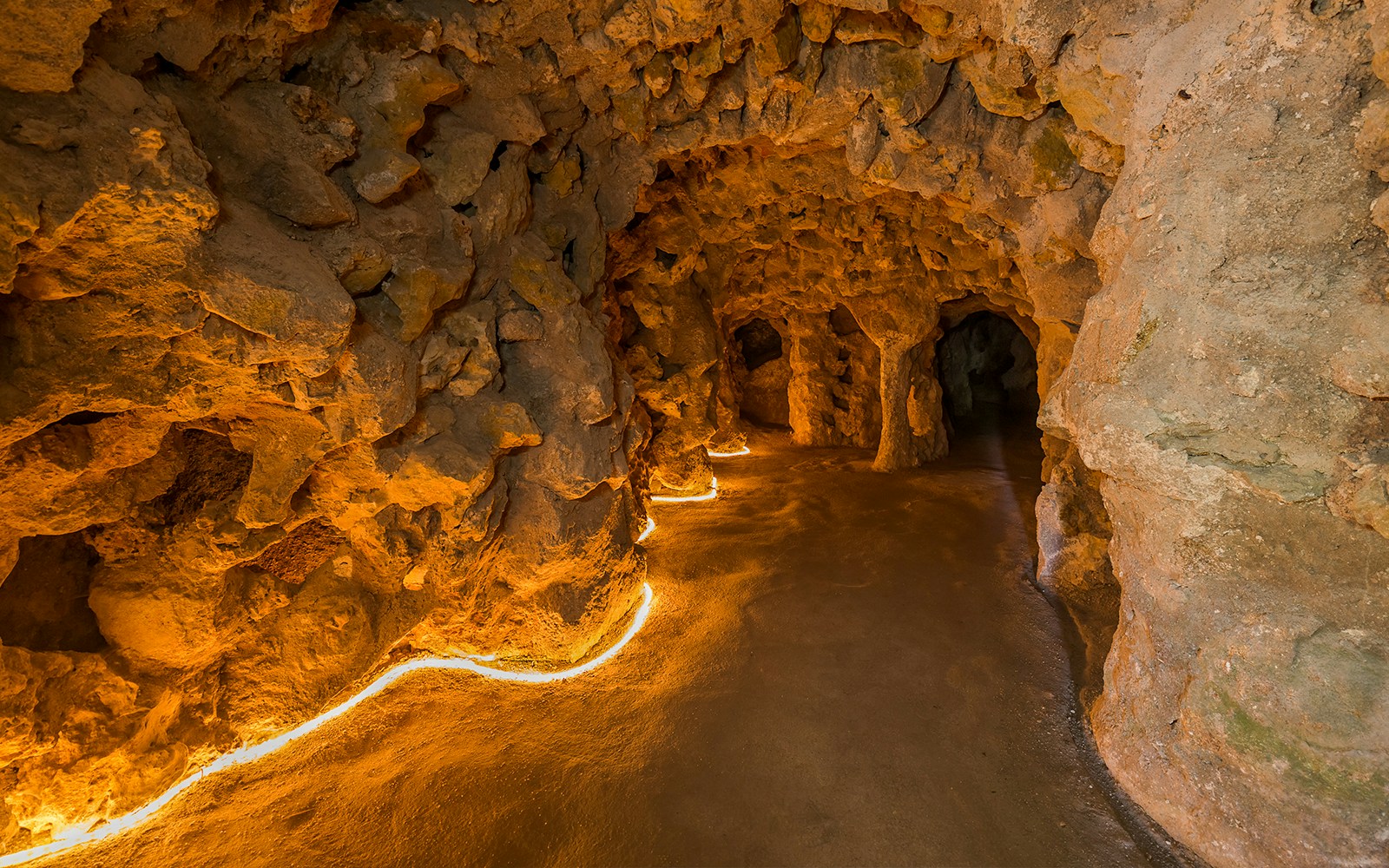 Underground tunnel with stone walls at Quinta da Regaleira, Lisbon.