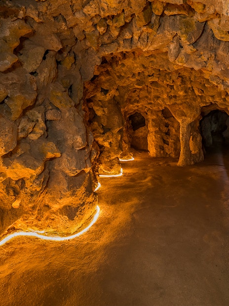 Underground tunnel with stone walls at Quinta da Regaleira, Lisbon.