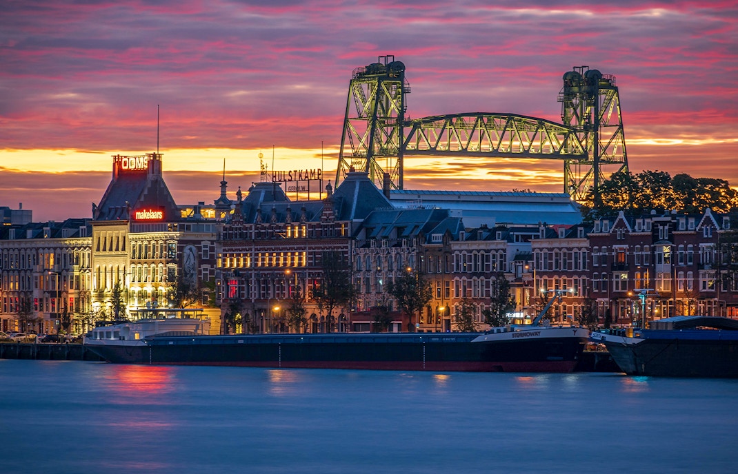 Noordereiland skyline at sunset with De Hef bridge, Rotterdam.