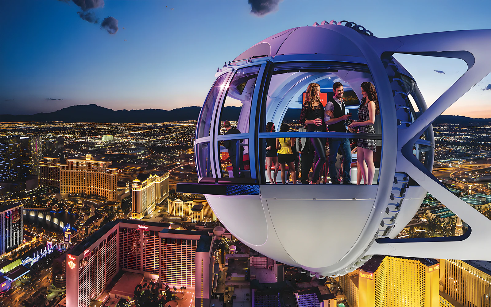 High Roller Wheel capsule overlooking Las Vegas Strip at dusk.