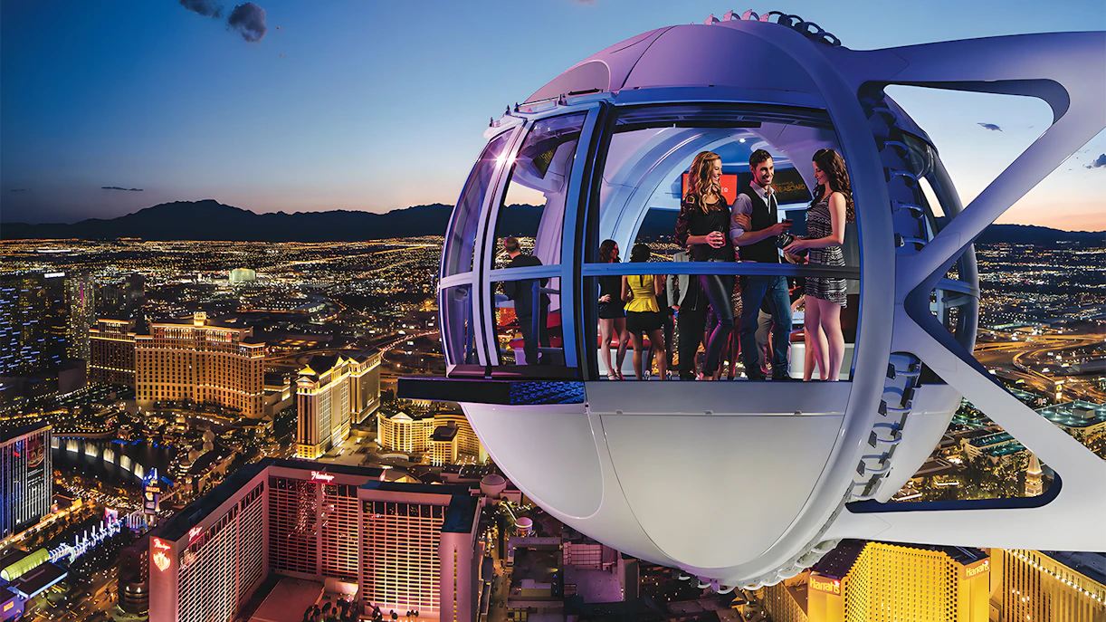 High Roller Wheel capsule overlooking Las Vegas Strip at dusk.