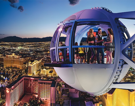 High Roller Wheel capsule overlooking Las Vegas Strip at dusk.