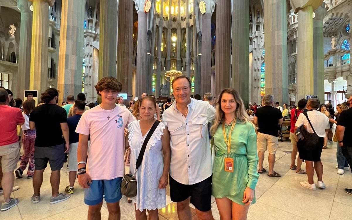 Tourist group with guide inside Sagrada Familia, Barcelona.