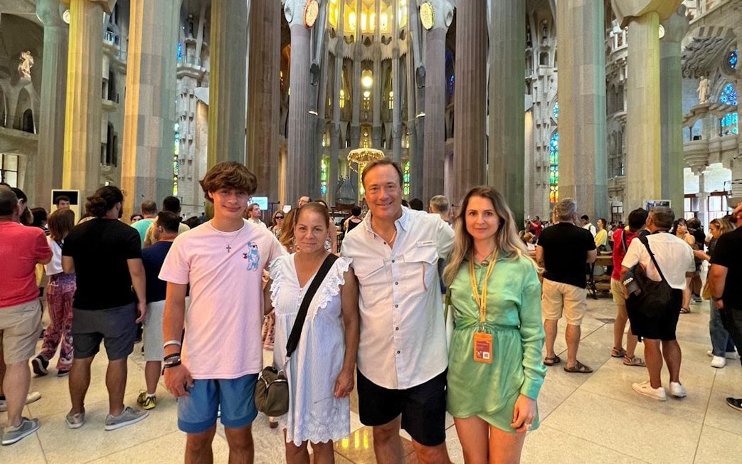 Tourist group with guide inside Sagrada Familia, Barcelona.