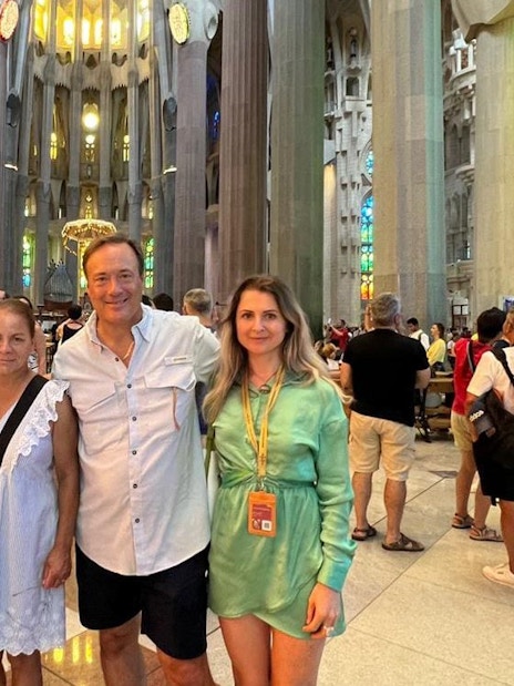 Tourist group with guide inside Sagrada Familia, Barcelona.