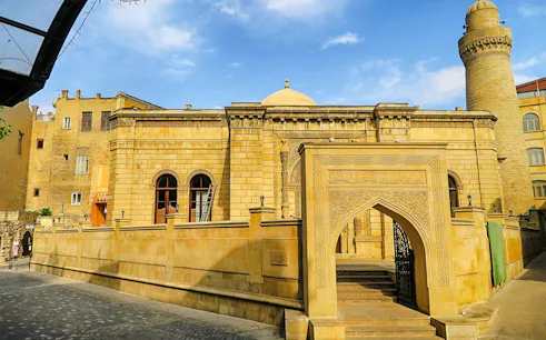 Historic building with intricate archway in Old Baku, Azerbaijan.