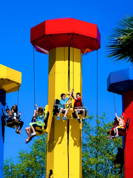Kids enjoying the Kid Power Tower ride at LEGOLAND Theme Park, Florida.