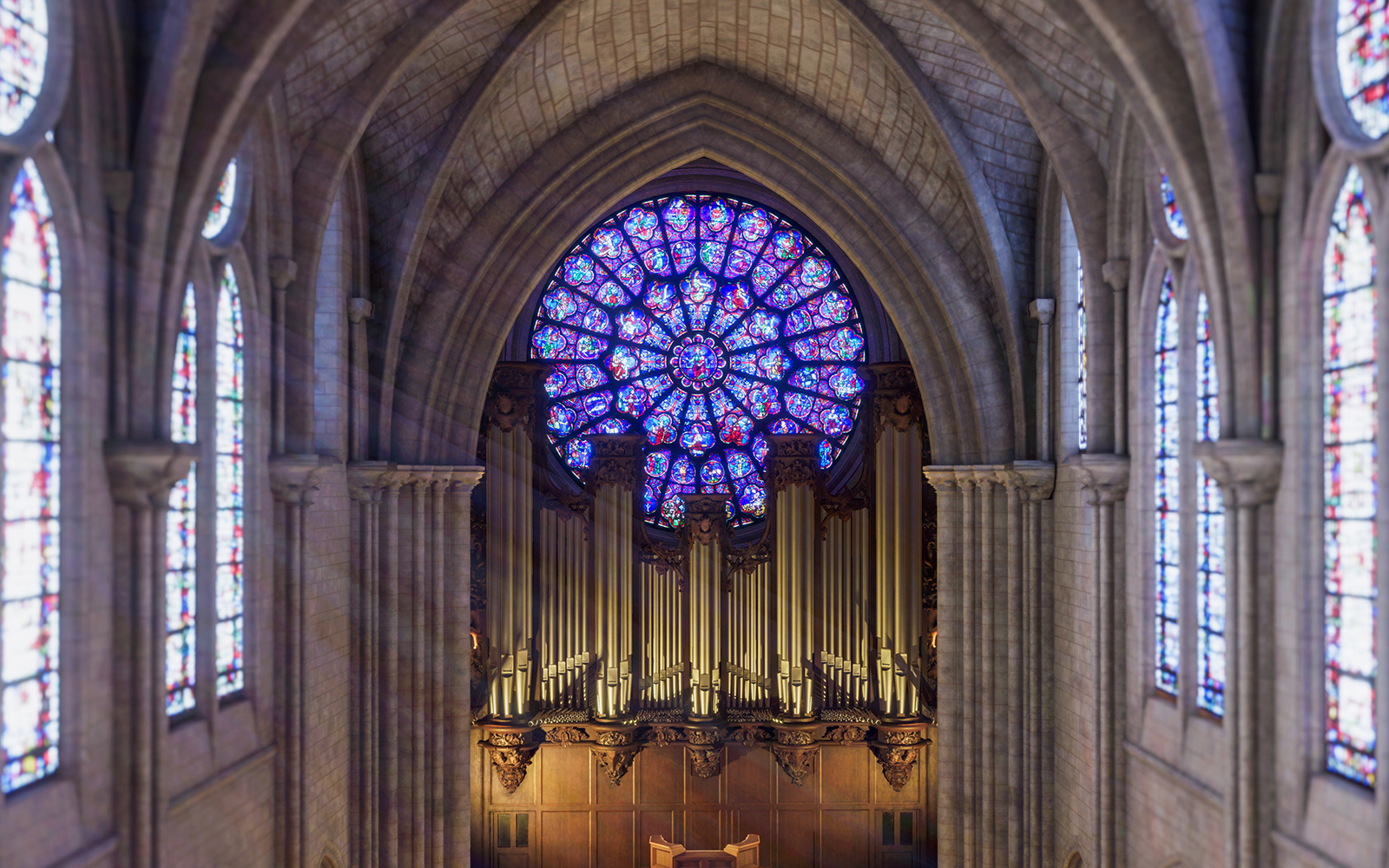 Stained glass rose window and organ inside Notre Dame Cathedral, Paris.