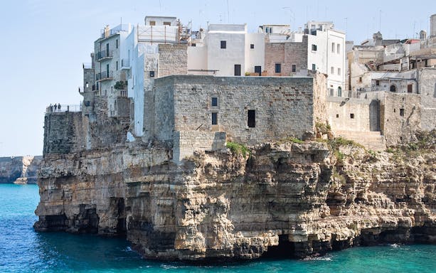 Cliffside buildings in Polignano a Mare overlooking the Adriatic Sea.