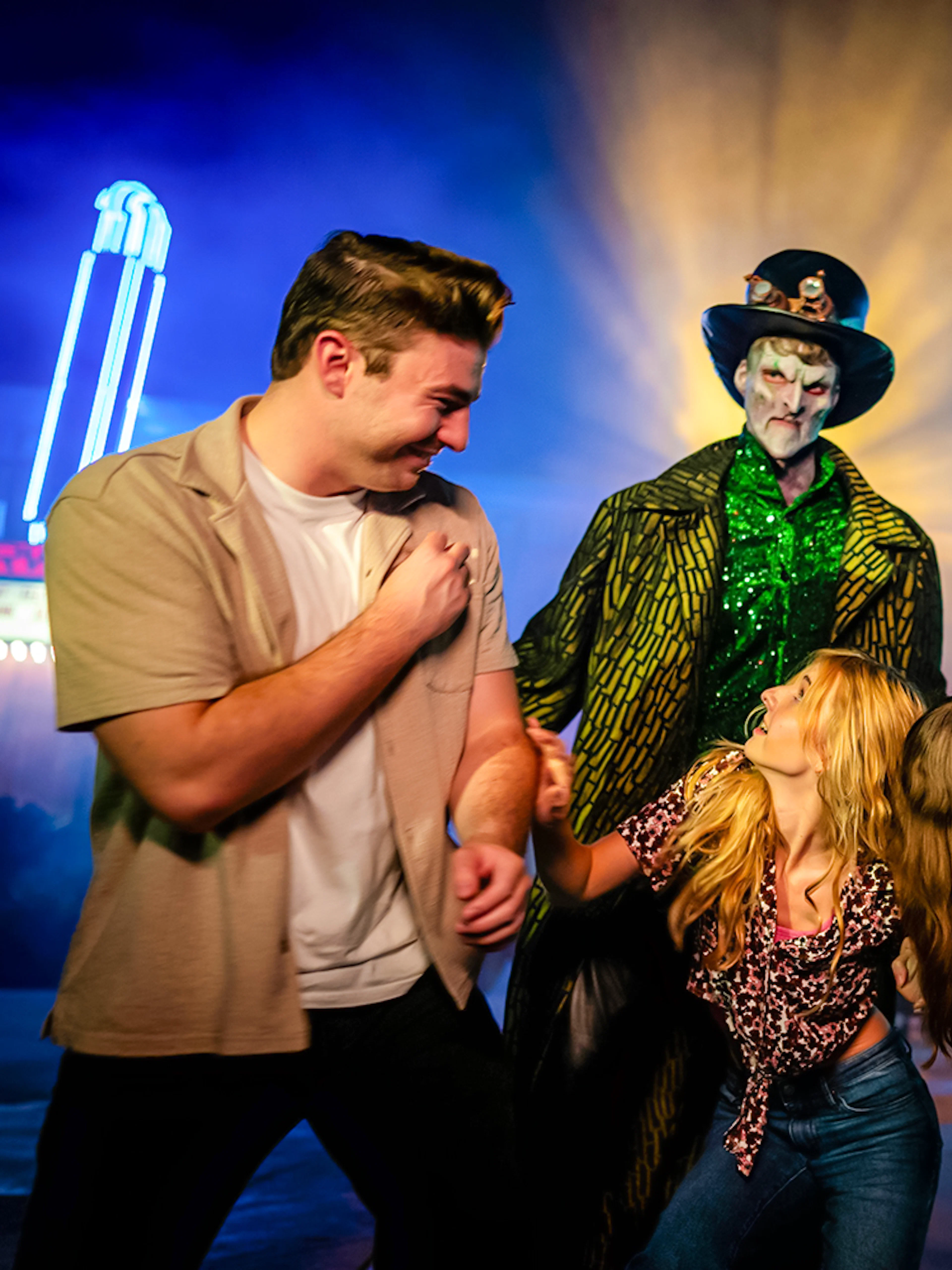 Guests interacting with costumed performers in Halloween Haunt zones at Dorney Park.