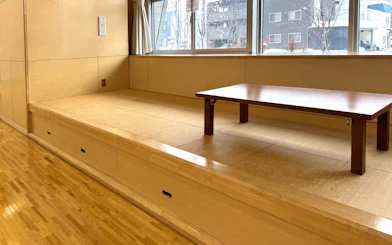Tatami room with low wooden table for samurai experience in Sapporo.