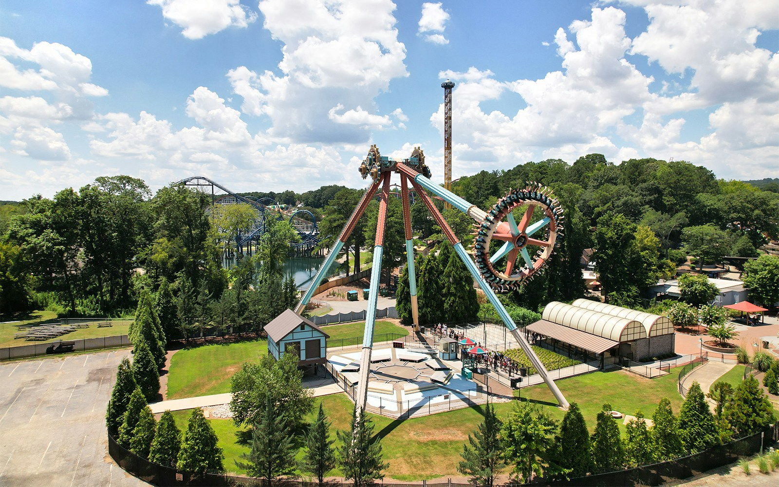 Aerial view of a thrill ride at Six Flags Over Georgia with surrounding greenery.