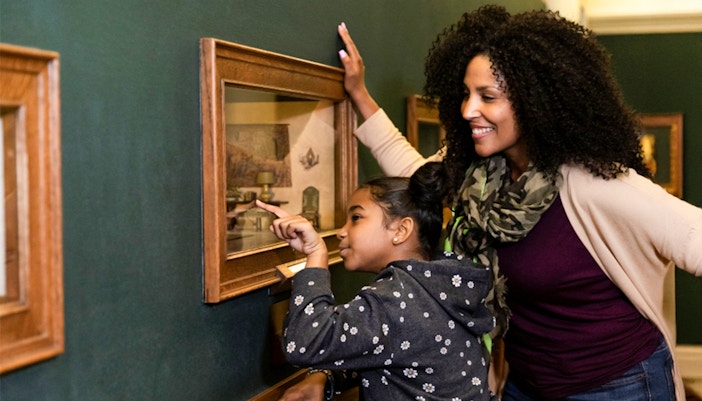 Visitors observing artwork at The Art Institute of Chicago.