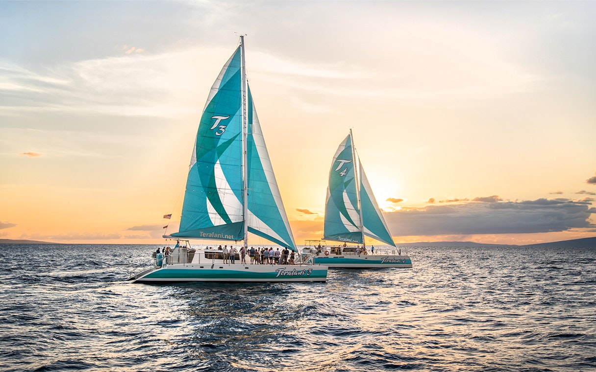 Sailboats on a luxury snorkel tour at sunset in Maui, Hawaii.
