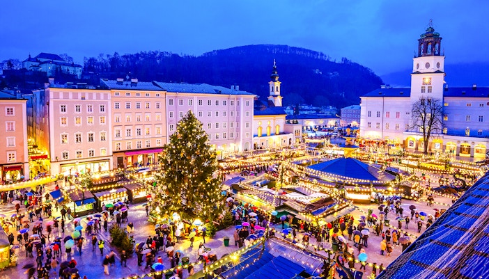 Salzburg Christmas Market with festive lights and crowds in Austria.