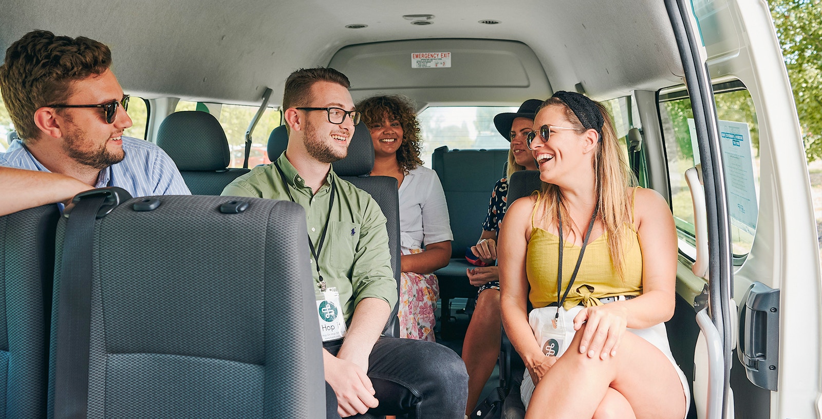 Group of friends in a Hop it minivan traveling to Yarra Valley, Melbourne tour.