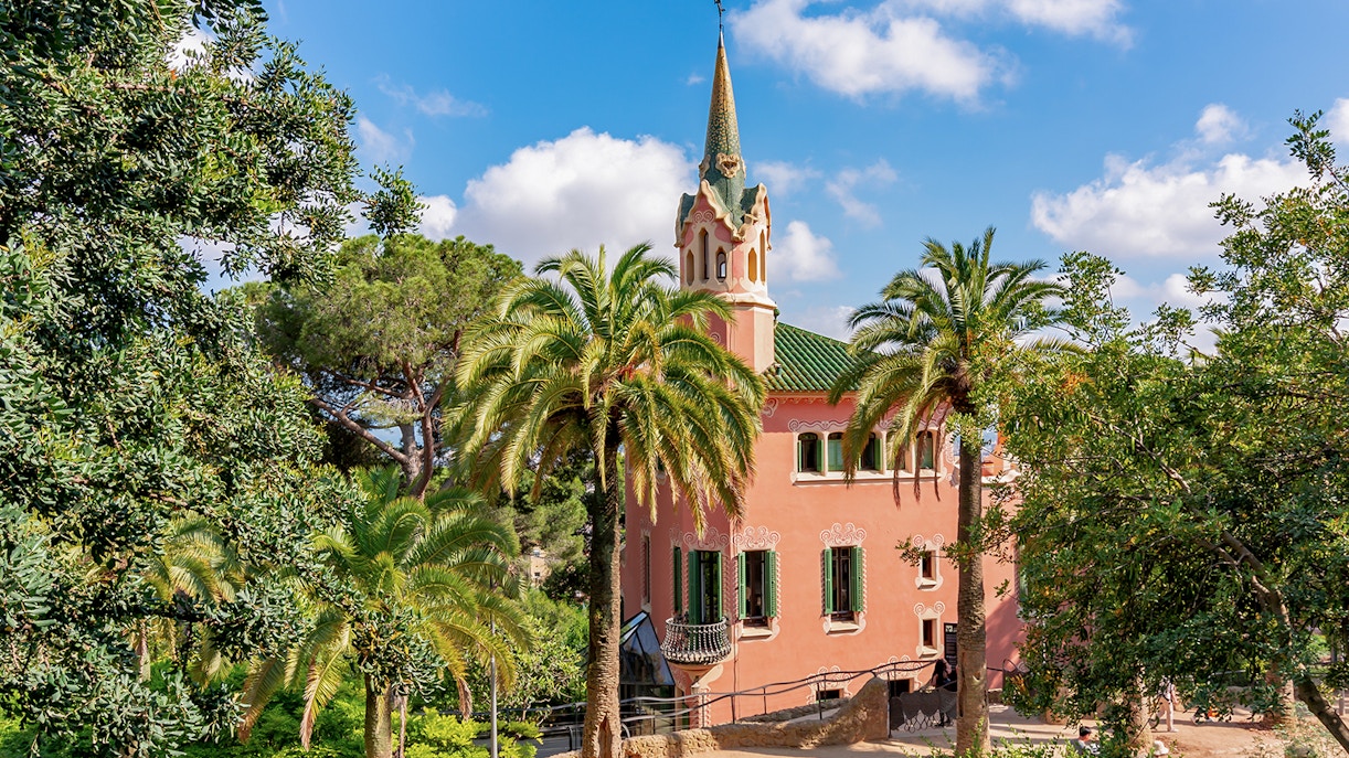 Park Guell Gaudi House Museum exterior with colorful mosaic tiles in Barcelona, Spain.