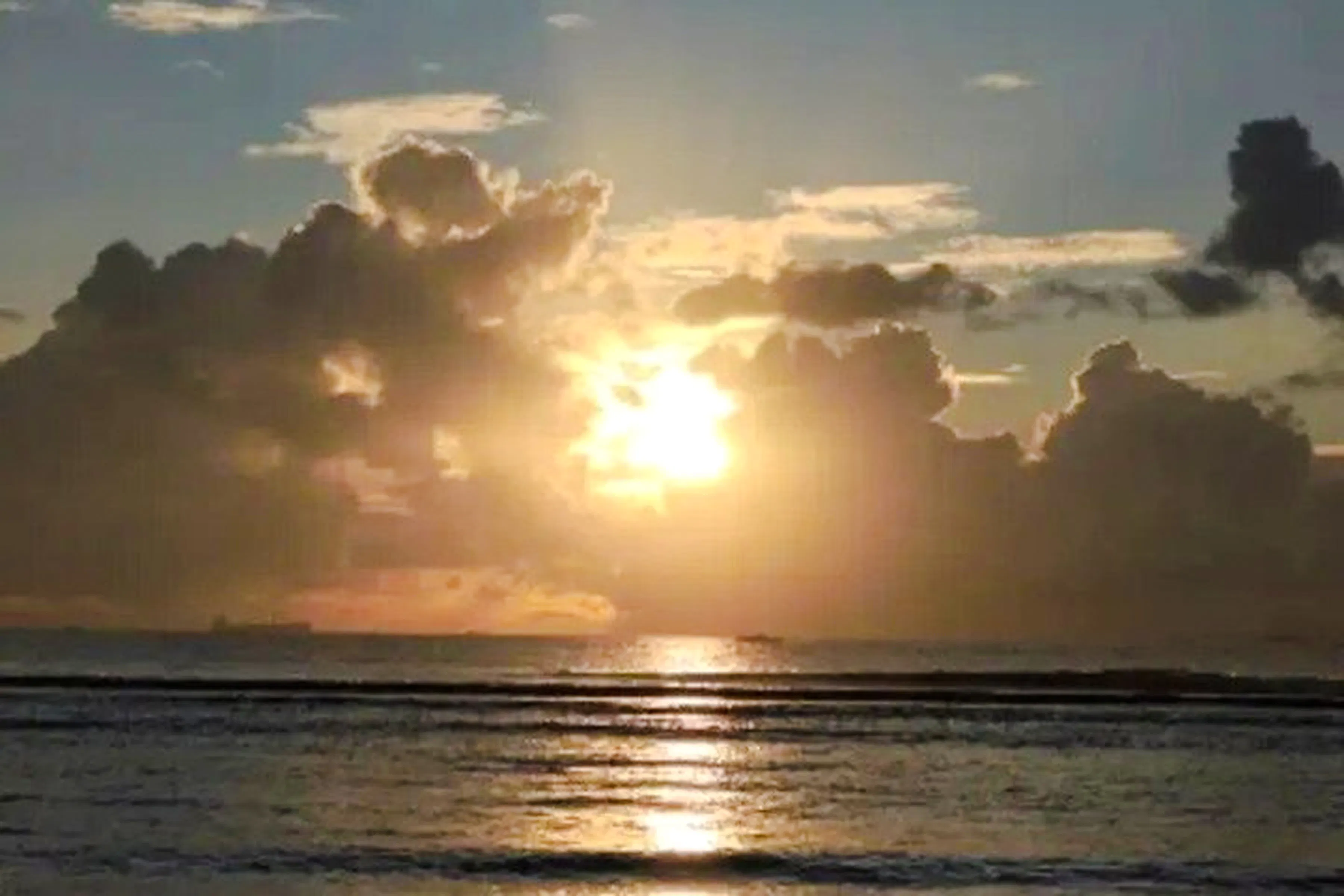 Sunset over the ocean in Zanzibar during the Dar es Salaam Masaki Walking Tuk-Tuk Fish Market Tour.