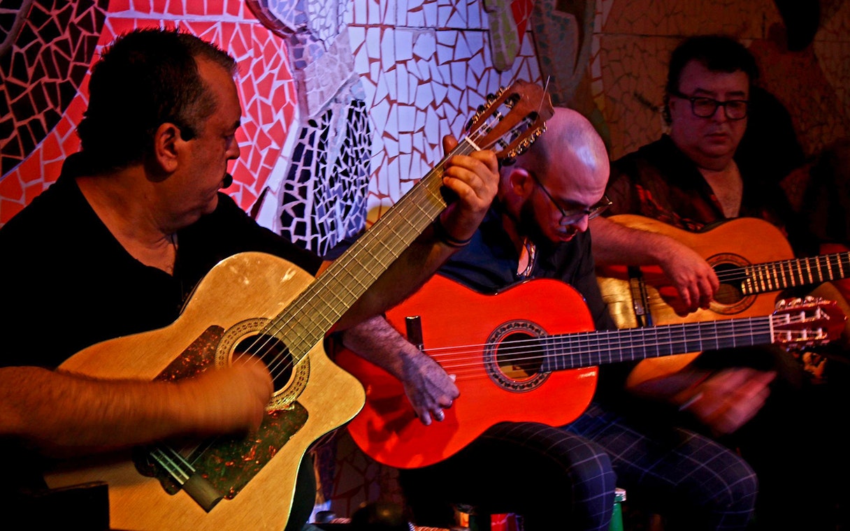 Musicians playing guitars at Flamenco Show, Tablao El Toro y la Luna.
