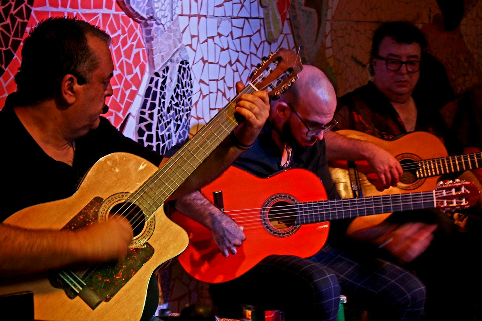 Musicians playing guitars at Flamenco Show, Tablao El Toro y la Luna.