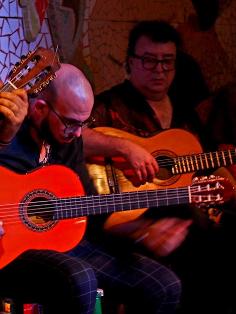 Musicians playing guitars at Flamenco Show, Tablao El Toro y la Luna.