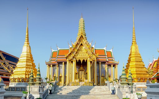 Wat Phra Kaew temple complex with golden spires, Bangkok, Thailand.