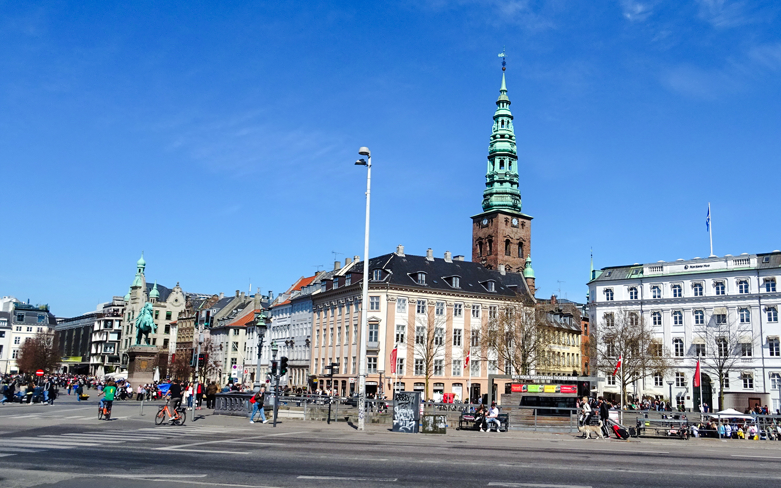 Nyhavn canal area with historic buildings and spire in København, Denmark.