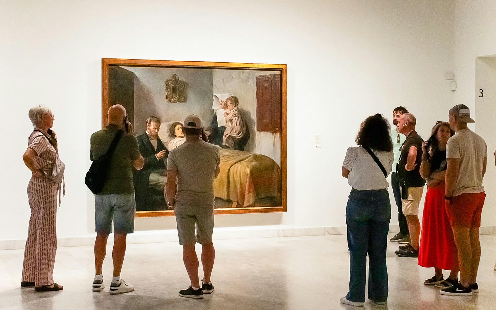 Visitors viewing a painting at the Picasso Museum during a skip-the-line guided tour.