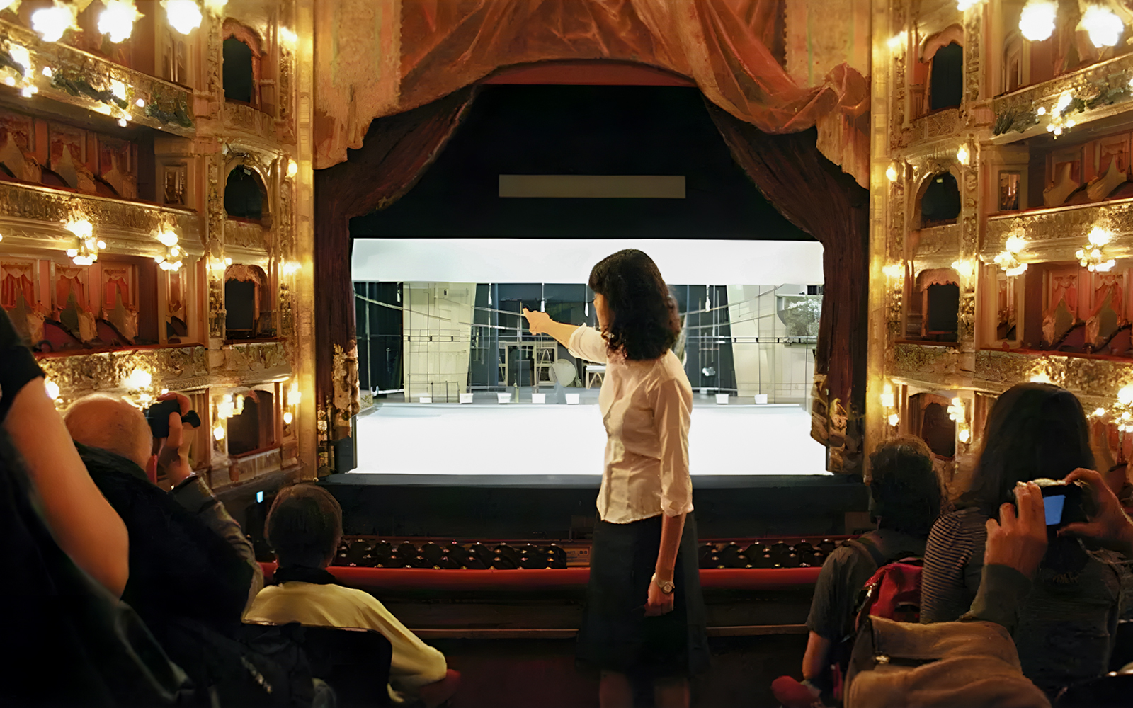 Tourist group with guide inside Teatro Colón, Buenos Aires, viewing stage.
