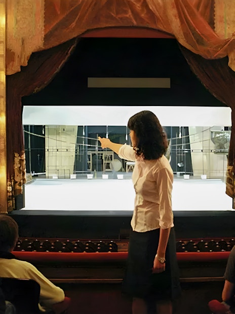 Tourist group with guide inside Teatro Colón, Buenos Aires, viewing stage.