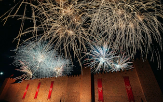 Fireworks display over castle walls during Christmas at Puy du Fou, España.