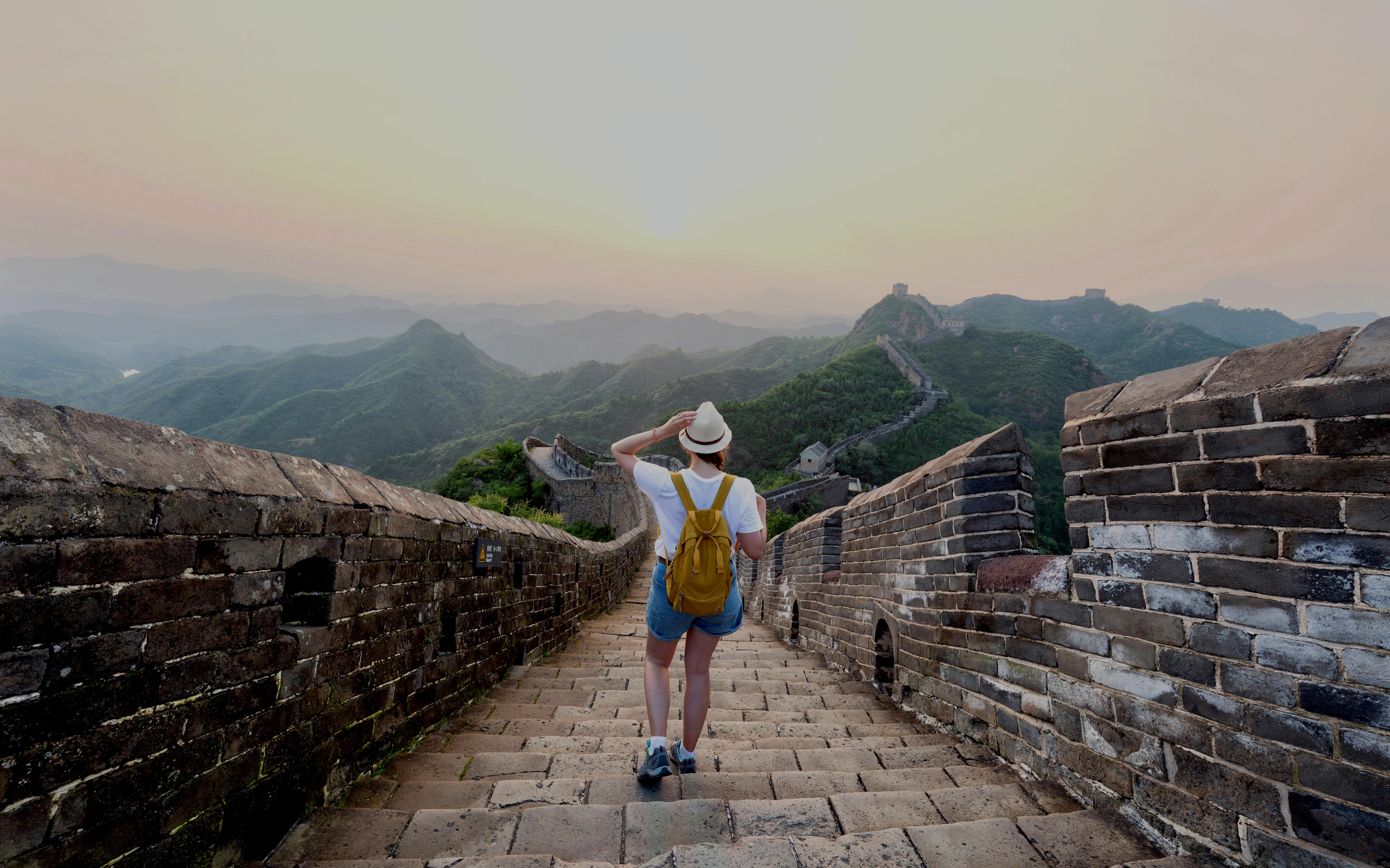 Traveler walking on the Great Wall of China at Badaling, Beijing, enjoying the view.