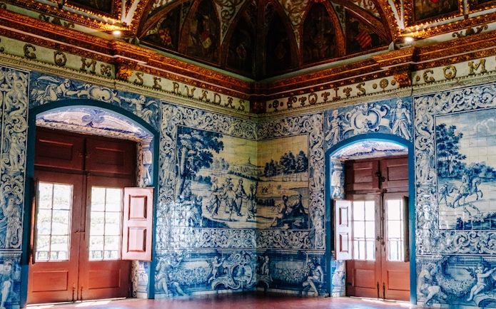 Heraldic Hall's intricate blue tiles in National Palace of Sintra, Portugal.