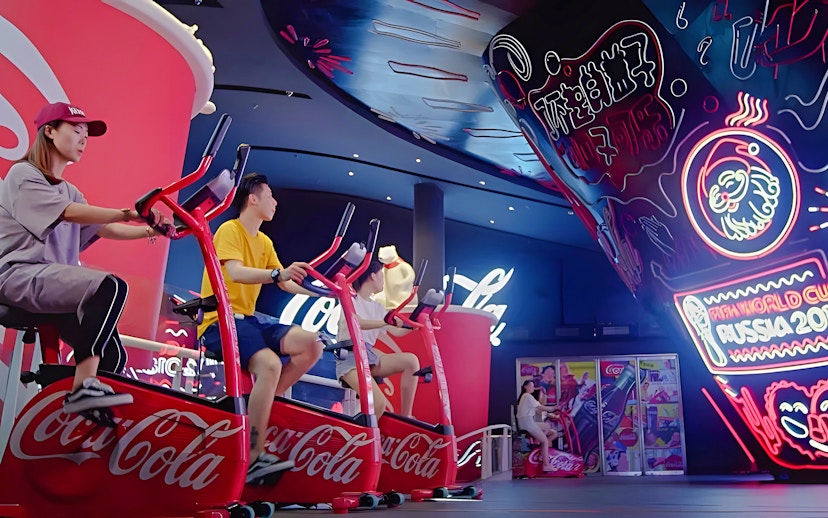 People biking at Coca-Cola mini park, Oriental Pearl Tower, Shanghai.